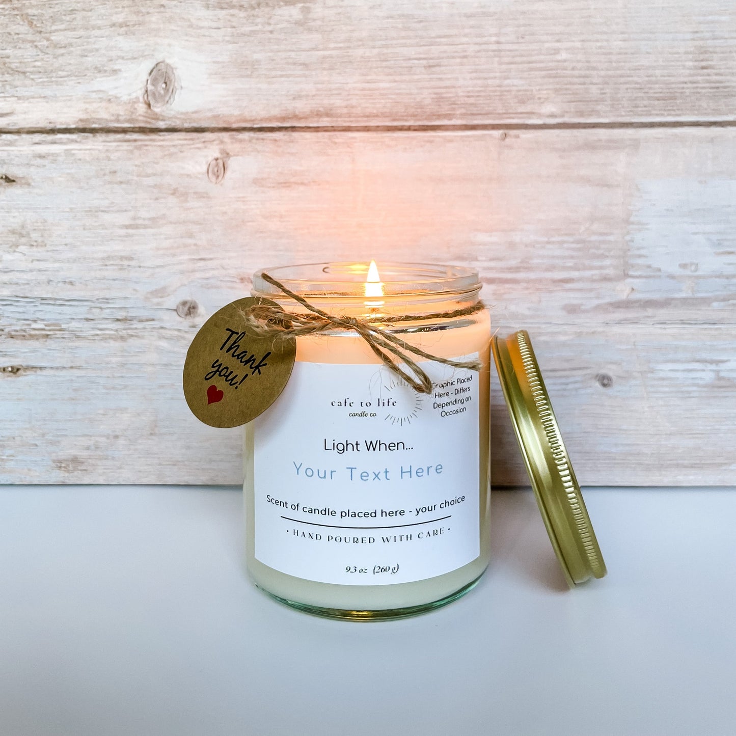 Lit candle with twine and a thank you tag. Label is customizable, says "Your Text Here" for customer to choose.